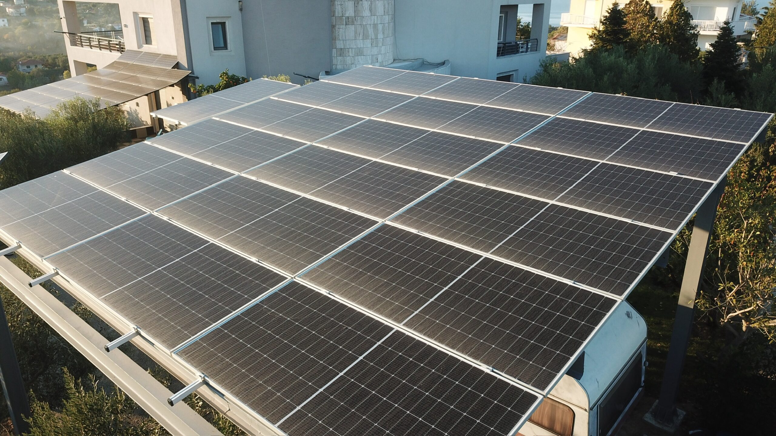 Solar panels integrated with a CPHD-certified passive house in Greece, showcasing Dynamiki ATE’s eco-friendly construction