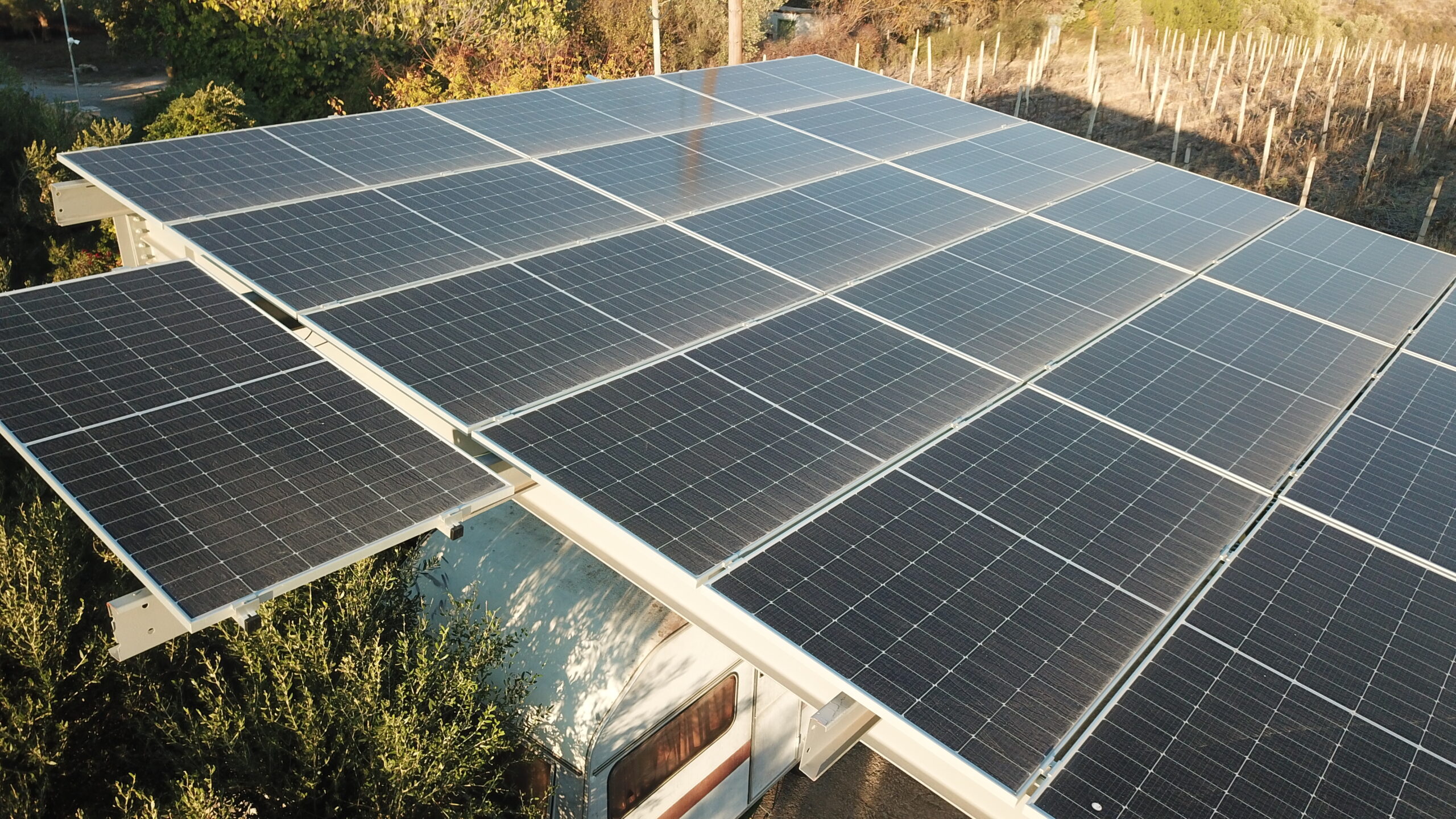 Solar panels integrated with a CPHD-certified passive house in Greece, showcasing Dynamiki ATE’s eco-friendly construction